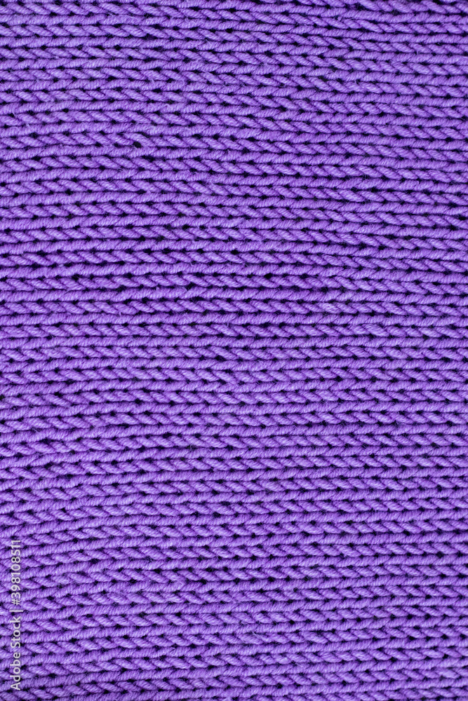 knitted background of lilac color, knitting concept. A hobby .Made by hand. knitted background of lilac color, knitting concept. A hobby .Made by hand.