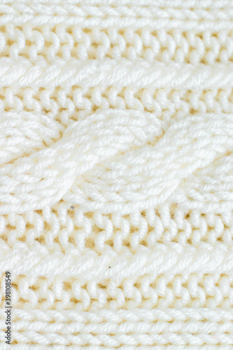 knitting hobby knitted background of milky color with a pattern