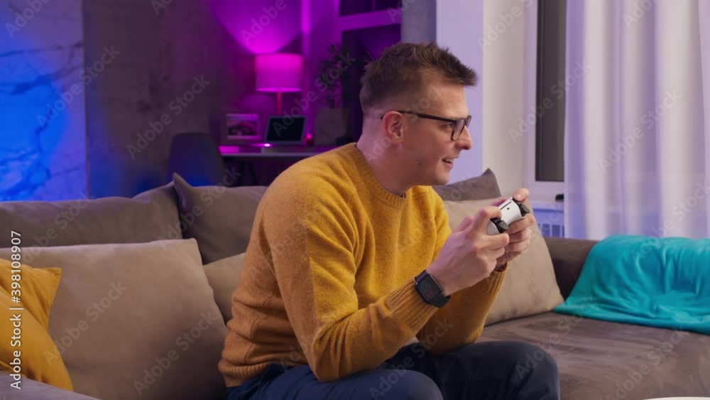 Excited man playing video games on modern console next gen 2020, new ...