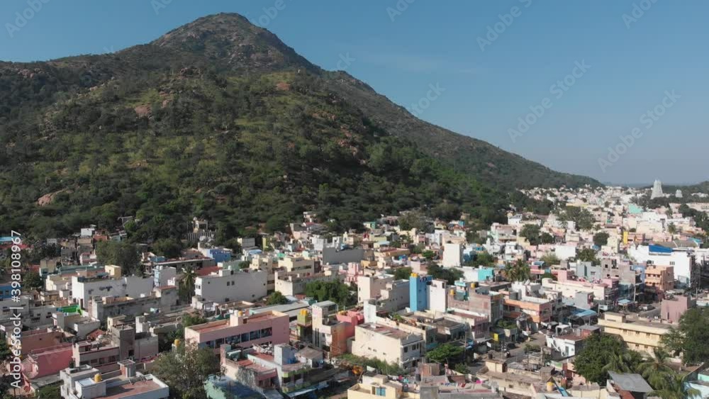 Beautiful aerial shot of housing area bordering huge mountain in India.Cinematic drone footage. Beautiful aerial shot of housing area bordering huge mountain in India.Cinematic drone footage.