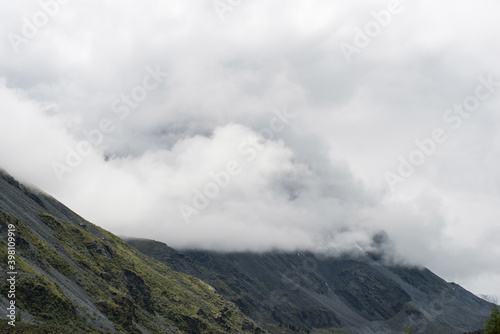 Altai mountains shrouded in white clouds, it looks quite gloomy