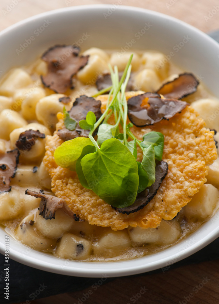 Gnocchi. Pasta sautéed with truffles garlic, onions, olive oil and fresh herbs and spices. Classic American steakhouse or French bistro appetizer or side dish. Gnocchi. Pasta sautéed with truffles garlic, onions, olive oil and fresh herbs and spices. Classic American steakhouse or French bistro appetizer or side dish.