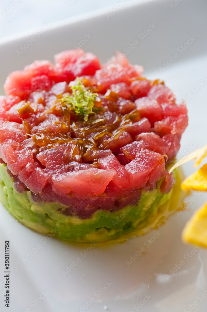 Tuna tartare. Classic American restaurant or bistro appetizer classic. Sushi grade ahi tuna, diced, mixed with eggs, red onions, olive oil, lemon juice, garlic and capers. Served with garlic bread. Tuna tartare. Classic American restaurant or bistro appetizer classic. Sushi grade ahi tuna, diced, mixed with eggs, red onions, olive oil, lemon juice, garlic and capers. Served with garlic bread.