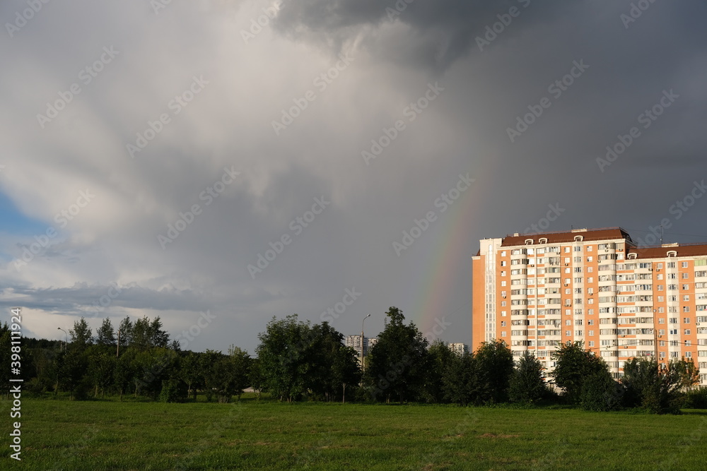 Dark rain clouds against the background of the Moscow sleeping area.
