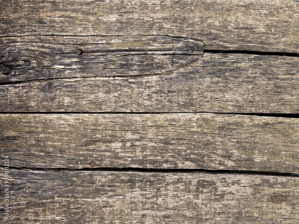 Old wooden planks used for household purposes outdoors on a cloudy day. Old wooden planks used for household purposes outdoors on a cloudy day.