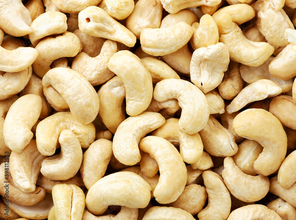 Cashew kernel closeup background. View of the top. Cashew kernel closeup background. View of the top.