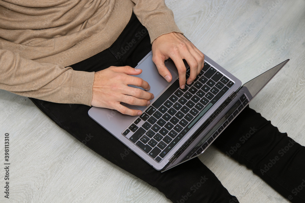 top view young man on the floor with laptop top view young man on the floor with laptop