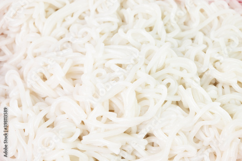 Close up view of white boiled laksa rice noodles.