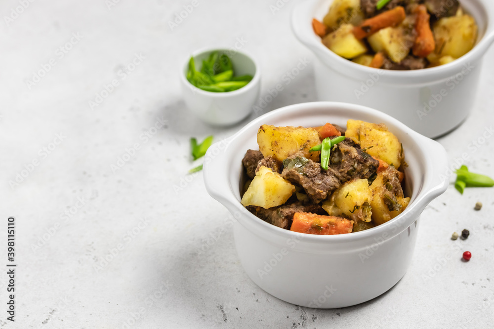 Traditional roast and potatoes in pots. Copy space. Traditional roast and potatoes in pots. Copy space.