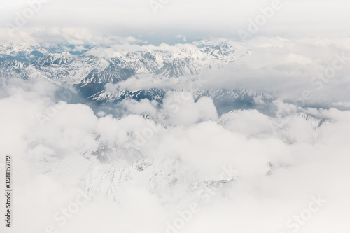 Aerial view of mountains and glaciers of Harriman Fiord in Alaska