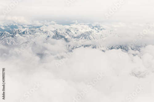 Aerial view of mountains and glaciers of Harriman Fiord in Alaska