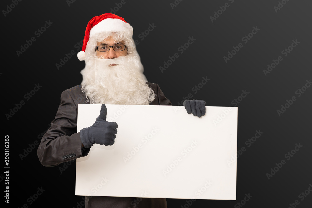 santa claus in costume shows white poster
