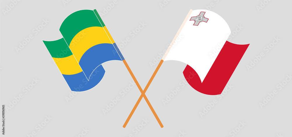 Crossed and waving flags of Gabon and Malta