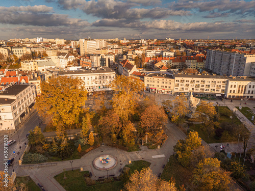 A drone view of the historic city with the market square, churches, town hall and the castle tower in Opole during sunset. Autumn in Silesia - Poland.