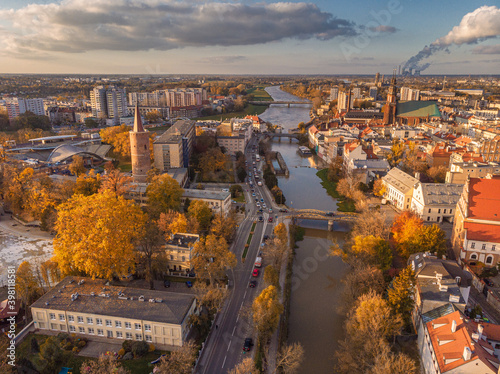 A drone view of the historic city with the market square, churches, town hall and the castle tower in Opole during sunset. Autumn in Silesia - Poland. © PawelUchorczak