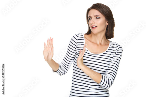 Beautiful young woman showing stop gesture on white background