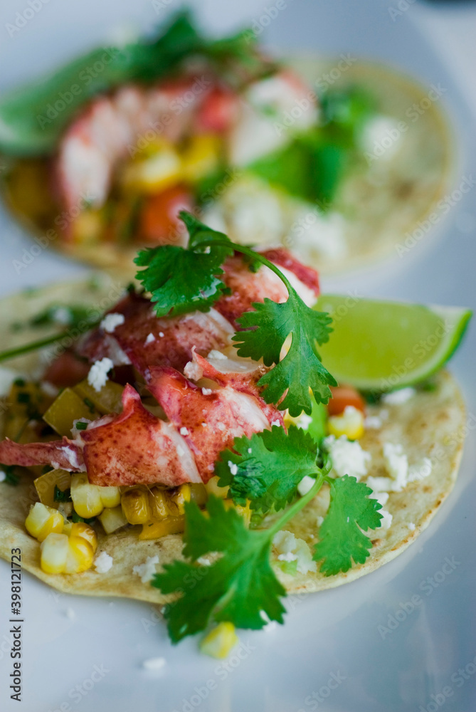 Fish or Lobster Tacos. Grilled lobster, mango slices, cheese, grilled bell peppers, onions, limes, cilantro and served on homemade corn tortillas. Classic Mexican or Tex-mex favorite. Fish or Lobster Tacos. Grilled lobster, mango slices, cheese, grilled bell peppers, onions, limes, cilantro and served on homemade corn tortillas. Classic Mexican or Tex-mex favorite.