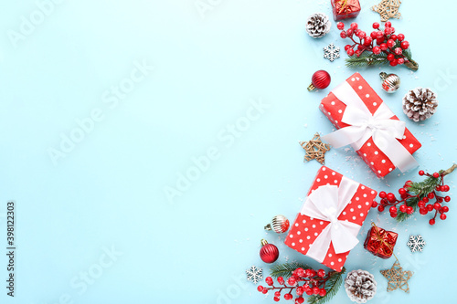 Gift boxes with ornaments on blue background