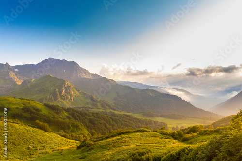 Beautiful mountain landscape at Caucasus mountains with clouds and blue sky © idea_studio