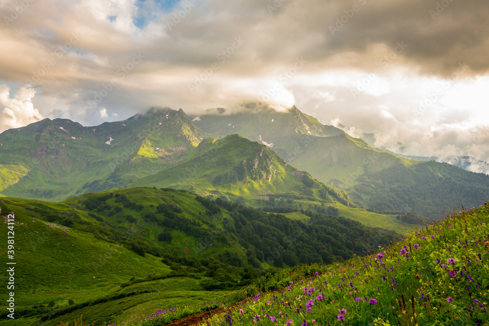 Obraz premium Beautiful mountain landscape at Caucasus mountains with clouds and blue sky