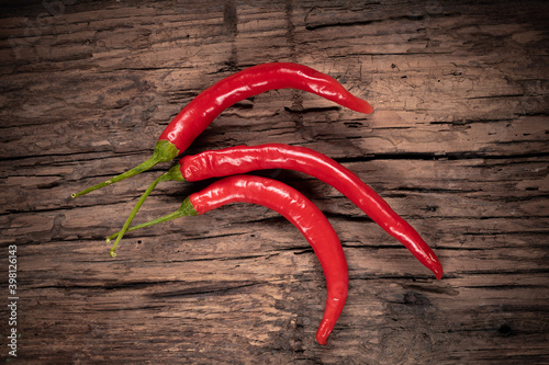 Red and hot pepper on wooden