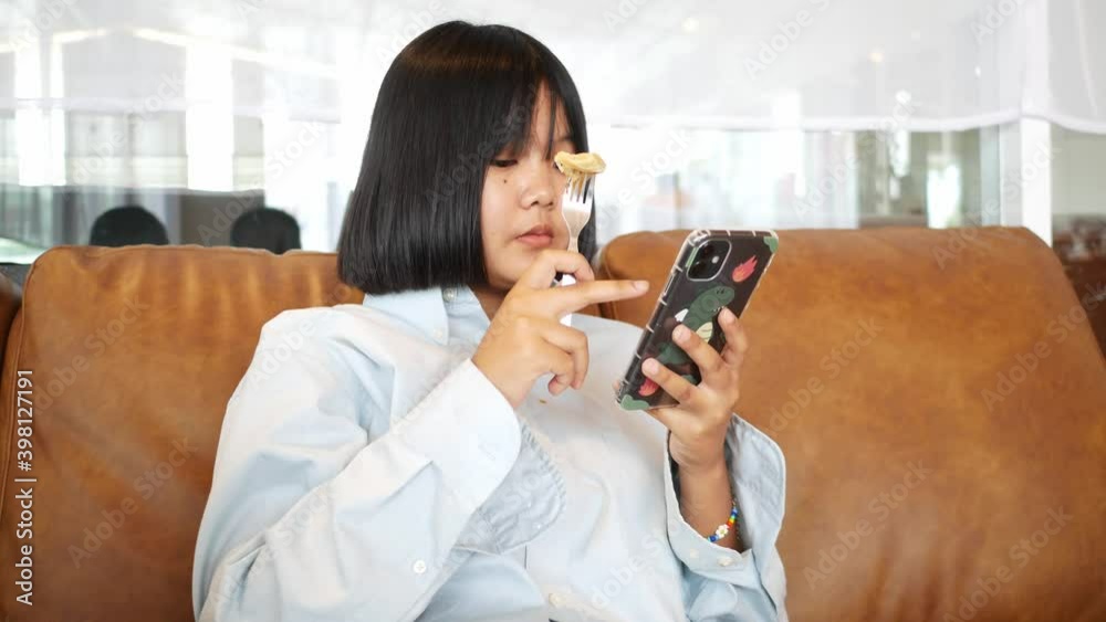 An Asian teenature rest relaxing in the living room An Asian teenature rest relaxing in the living room