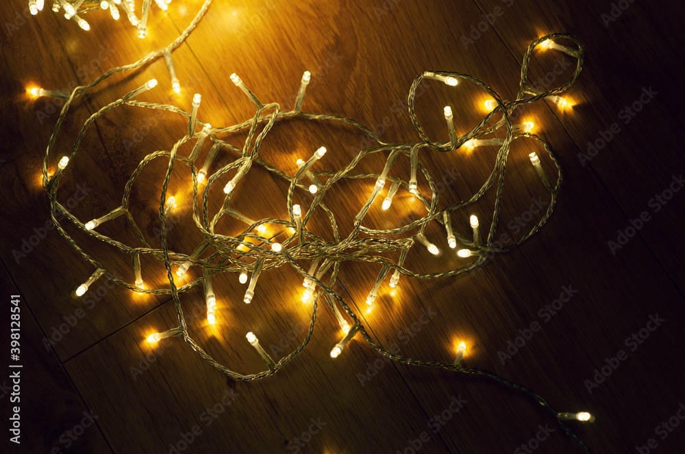 A ball of christmas lights on the floor