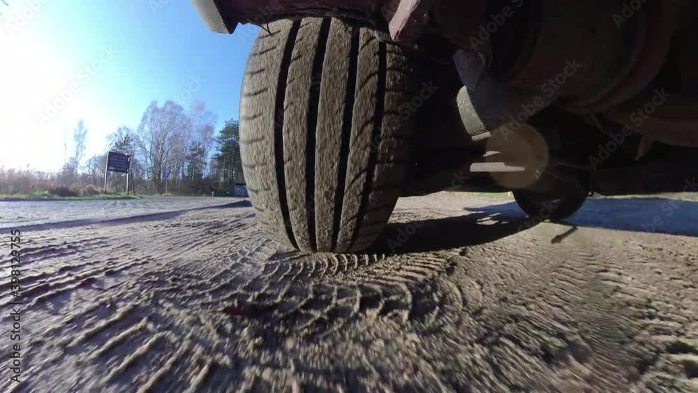 Car Tyre and Suspension System When Driving on Dirt Road Wide Angle POV Car Tyre and Suspension System When Driving on Dirt Road Wide Angle POV