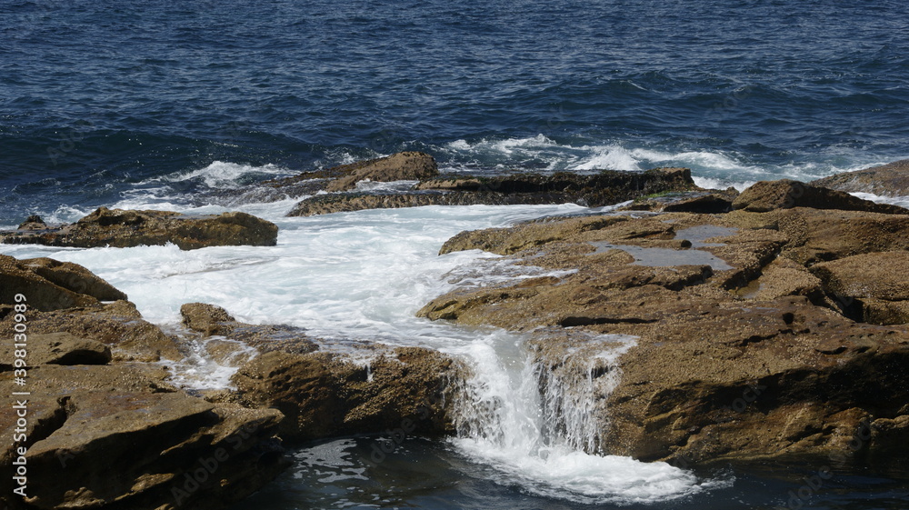 waves crashing on rocks