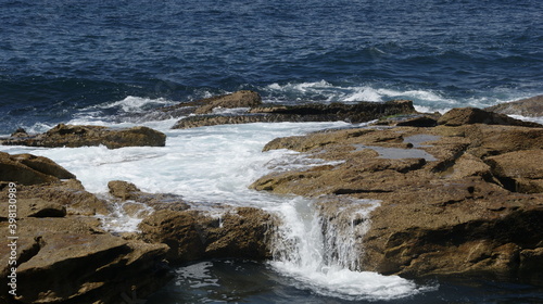 waves crashing on rocks