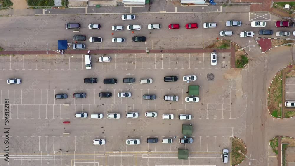 Corona Virus Vaccination drive through, with medical teams approaching and treating Car passengers.
