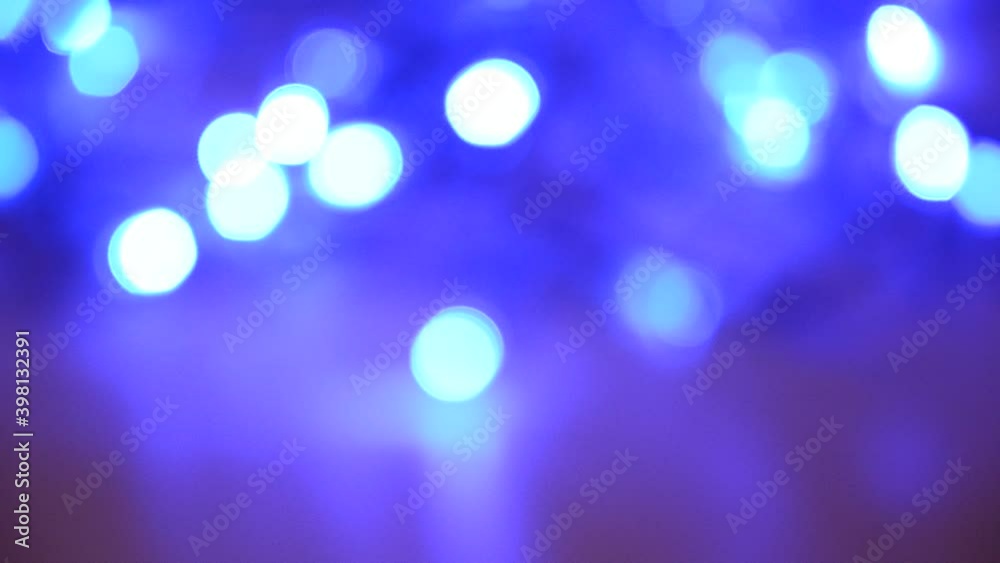 Abstract blue bokeh lights glowing on dark background Abstract blue bokeh lights glowing on dark background