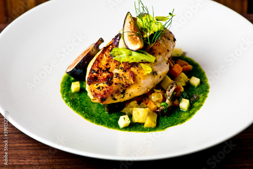 Obraz na płótnie Chicken breast, pan seared to a crispy golden brown in brown butter and served with farm fresh organic vegetables: carrots, Brussels sprouts and green beans
