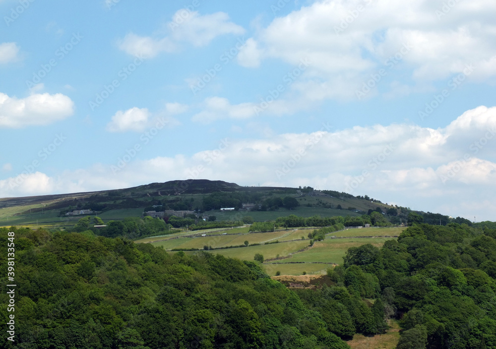 panoramic view across the calder valley in west yorkshire with midgley moor village and farmhouses in summer panoramic view across the calder valley in west yorkshire with midgley moor village and farmhouses in summer