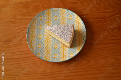Tasty Chessecake on the plate on the wooden background
