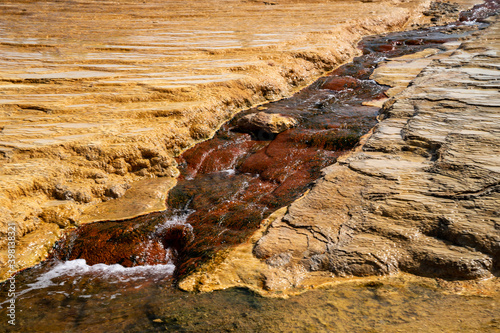 Captive geyser in Soda Springs Idaho. Mineral terraces of the hot springs photo