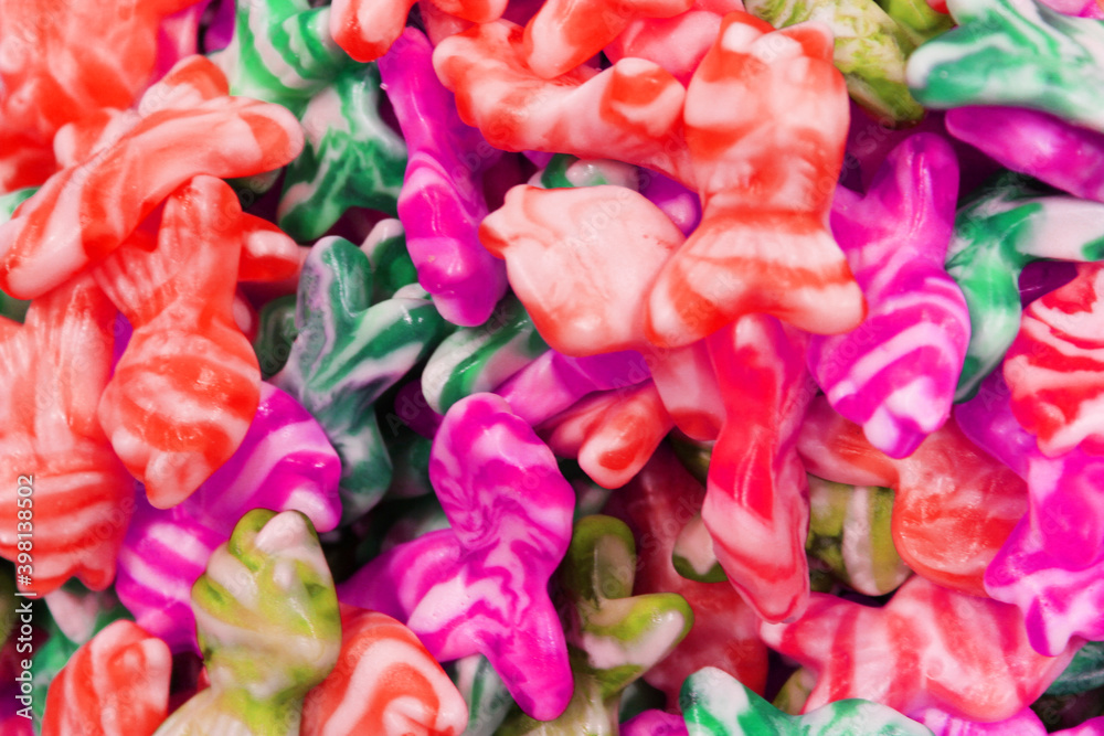 Colorful texture using as background. A lot of sweets. Background 3d rendering illustration. Orange and black multiple jelly candies in powdered sugar. Confectionery wallpaper concept. Copy space Colorful texture using as background. A lot of sweets. Background 3d rendering illustration. Orange and black multiple jelly candies in powdered sugar. Confectionery wallpaper concept. Copy space