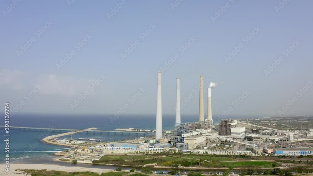 Coal and Gas fired power station - Aerial view including a Flue-Gas chimney. Coal and Gas fired power station - Aerial view including a Flue-Gas chimney.