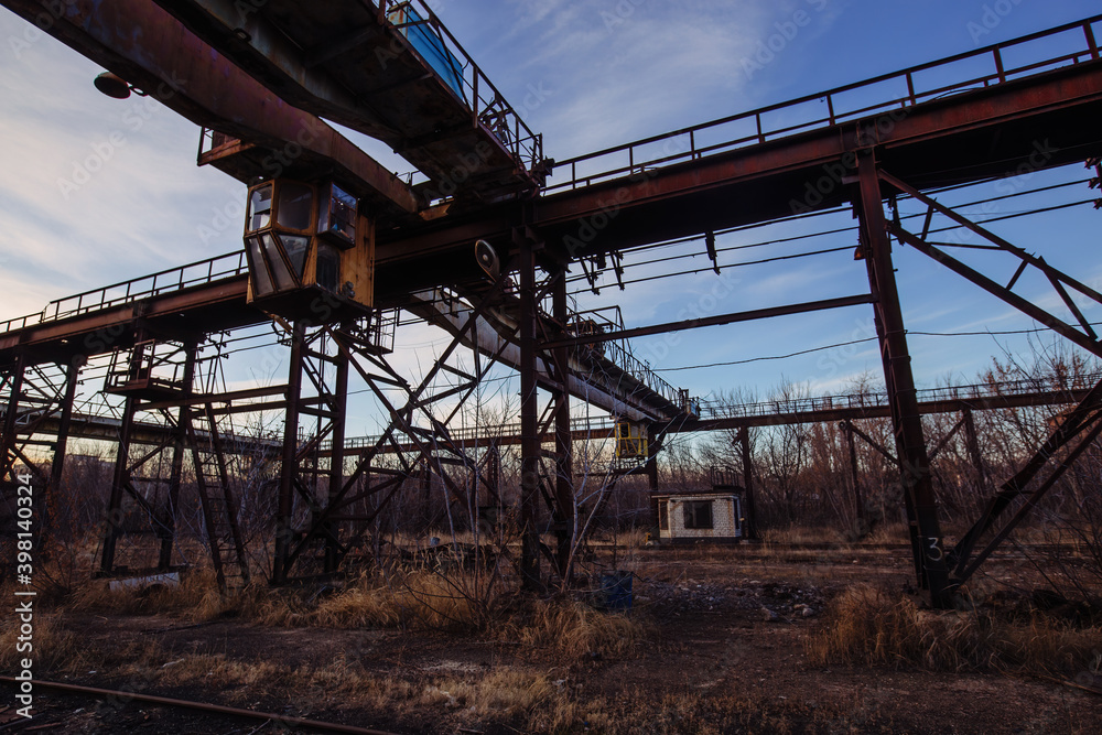 Old rusty overhead crane at abandoned industrial area Old rusty overhead crane at abandoned industrial area