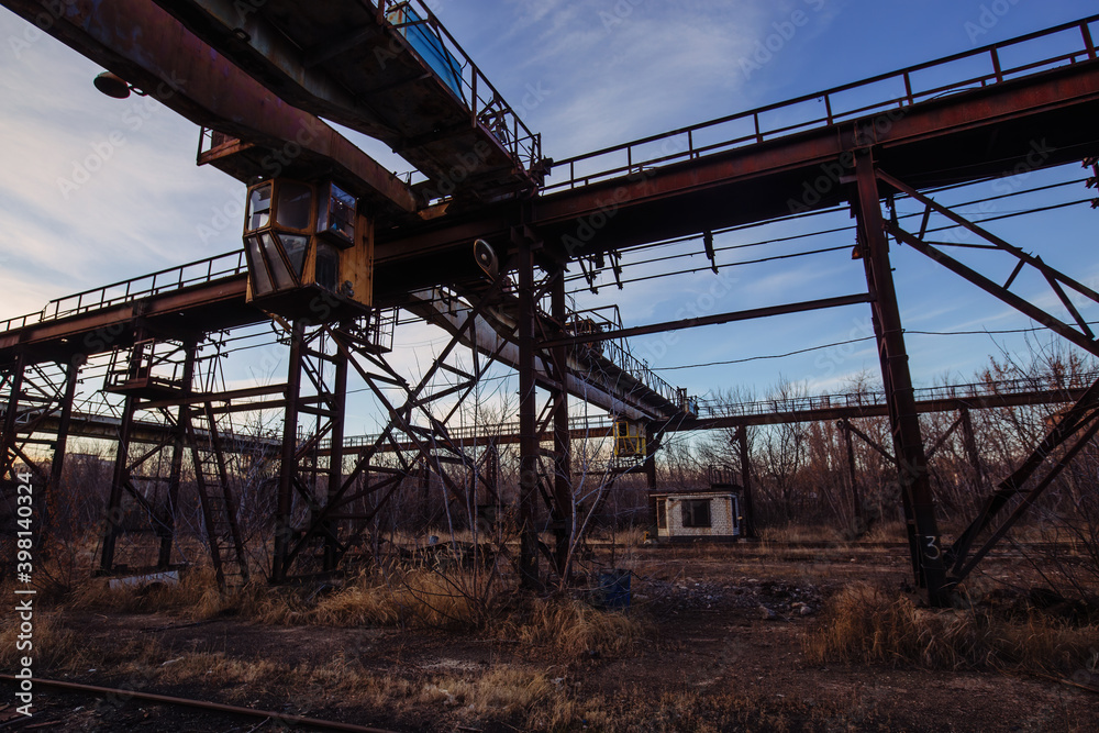 Old rusty overhead crane at abandoned industrial area