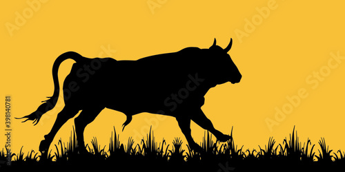  isolated black silhouette of an attacking running bull, grass, elements for design and decoration