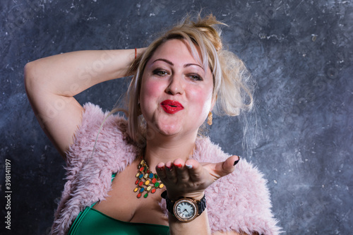 Attractive plump woman studio portrait close up view. photo