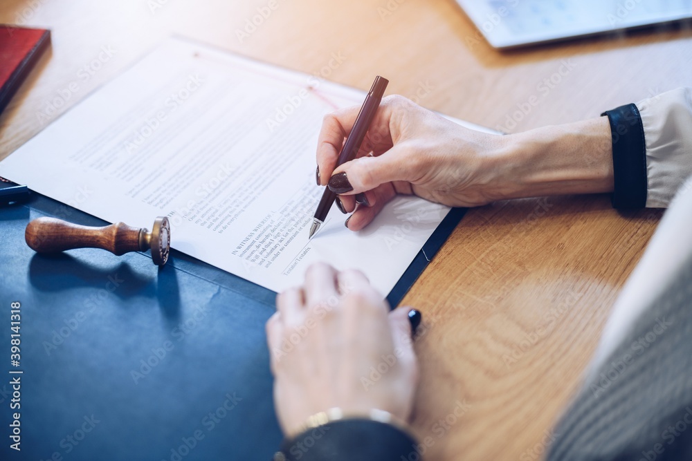 Lawyer business women working and notary signs the documents at office. Lawyer business women working and notary signs the documents at office.