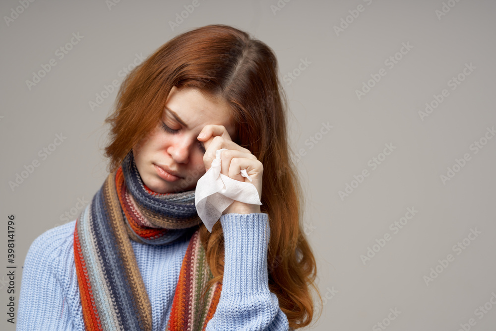 woman in sweater with napkin in hand runny nose health problems scarf sweater model woman in sweater with napkin in hand runny nose health problems scarf sweater model