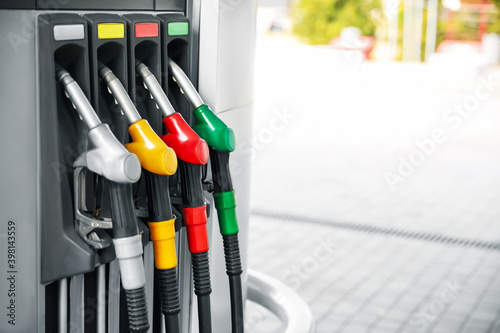 Fototapeta Naklejka Na Ścianę i Meble -  Fuel pump nozzles at modern gas station
