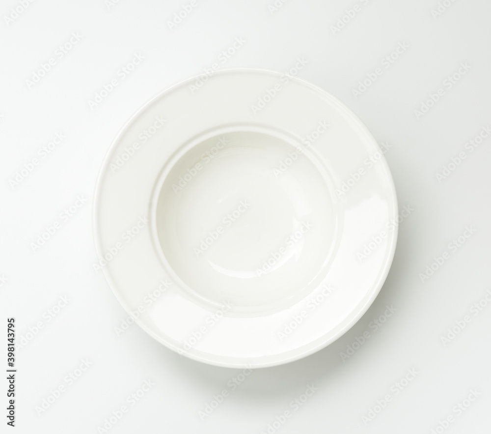 empty white ceramic plate on a white background empty white ceramic plate on a white background