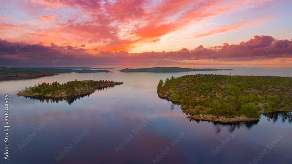 Ladoga lake. Landscape of Karelia. Nature of Russia. Skers of Ladoga Lake. Sunrise in Karelia. Lake in Russian Federation. Small islands in middle of the bay top view.Travel to regions of Russia