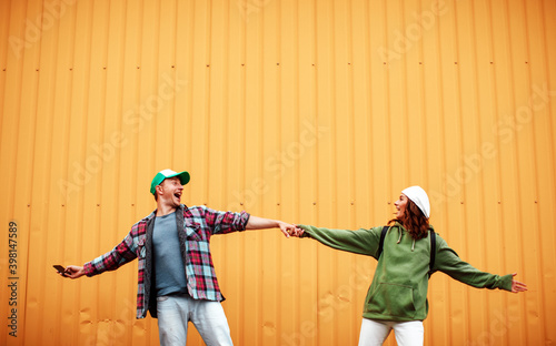 Happy hipster couple in love. Couple in love. Crazy photo. Sensual. Photo. Fun. Funny photo. Background. Man and woman posing. Happy.