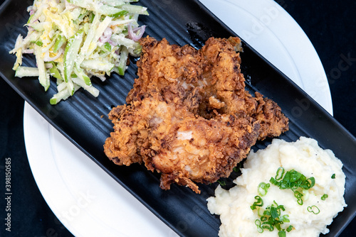 Overhead view of delicious fried chicken with mashed potatoes makes the mouth water and the stomach growl. photo