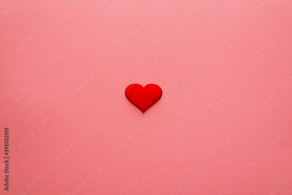 Valentine's Day. Red heart on a pink background. Valentine's day holiday background with heart.